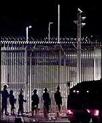 Police at the Woomera detention centre of immigrants in southern Australia